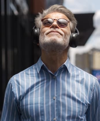 happy-senior-person-listening-music